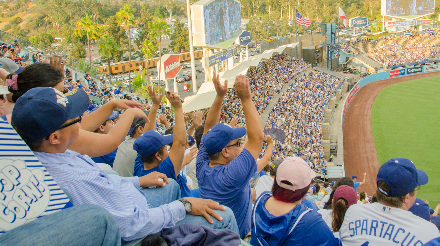 Crowd in stands cheering at Dodger Stadium