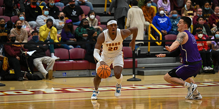Men's basketball player dribbling