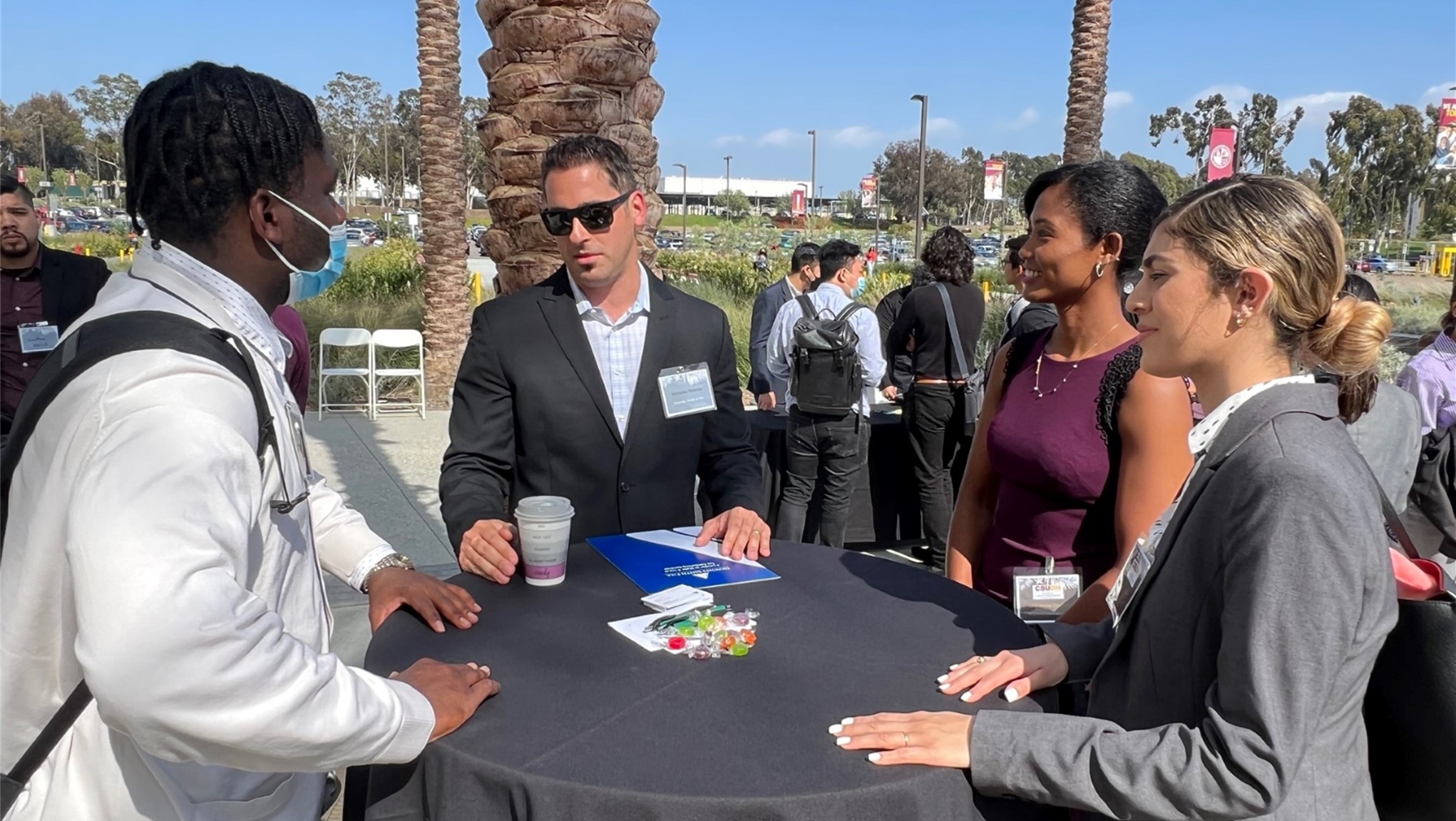 students and professionals networking in the courtyard