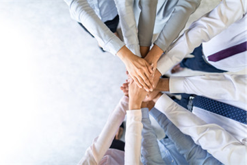 hands touching each other in a circle