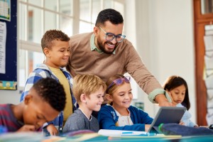 Educator in Classroom teaching students about AI