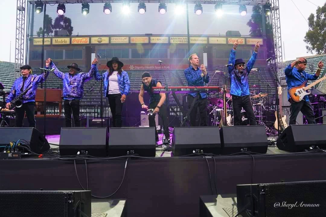 Performers on stage posing