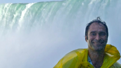 Dr. Keyantash in front of a magnificent waterfall