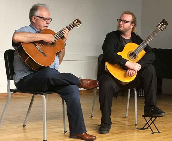 two classical guitar players