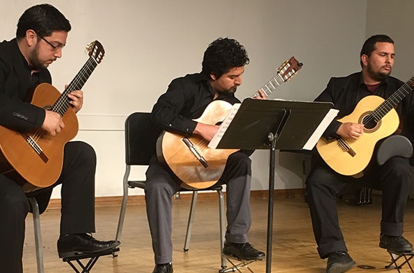 three classical guitar players
