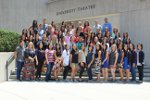 large group of student in front of theatre