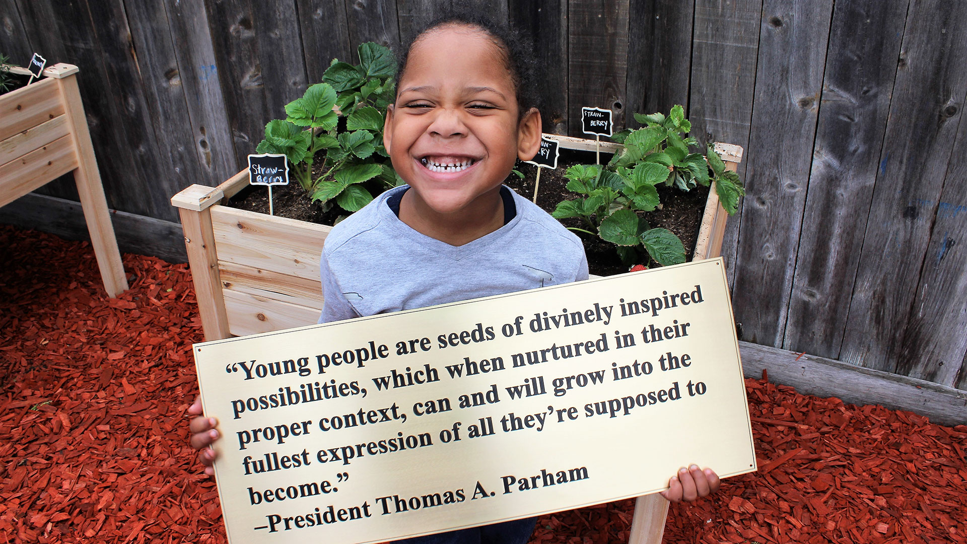Child Holding Quote
