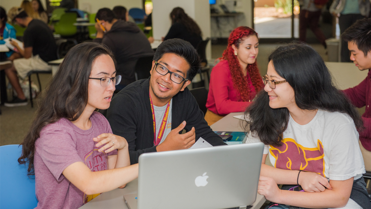 CSUDH Students Studying with a TLTC Tutor Students being tutored at the TLTC