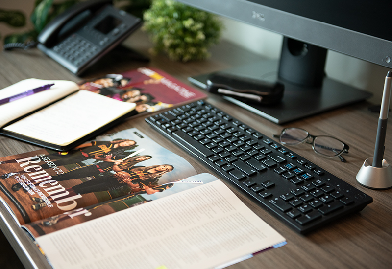 Desk with magazine and notebook